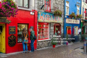 Galway, Ireland - August 07, 2018: Shops, pubs and restaurants along one of the main pedestrian streets in Galway.